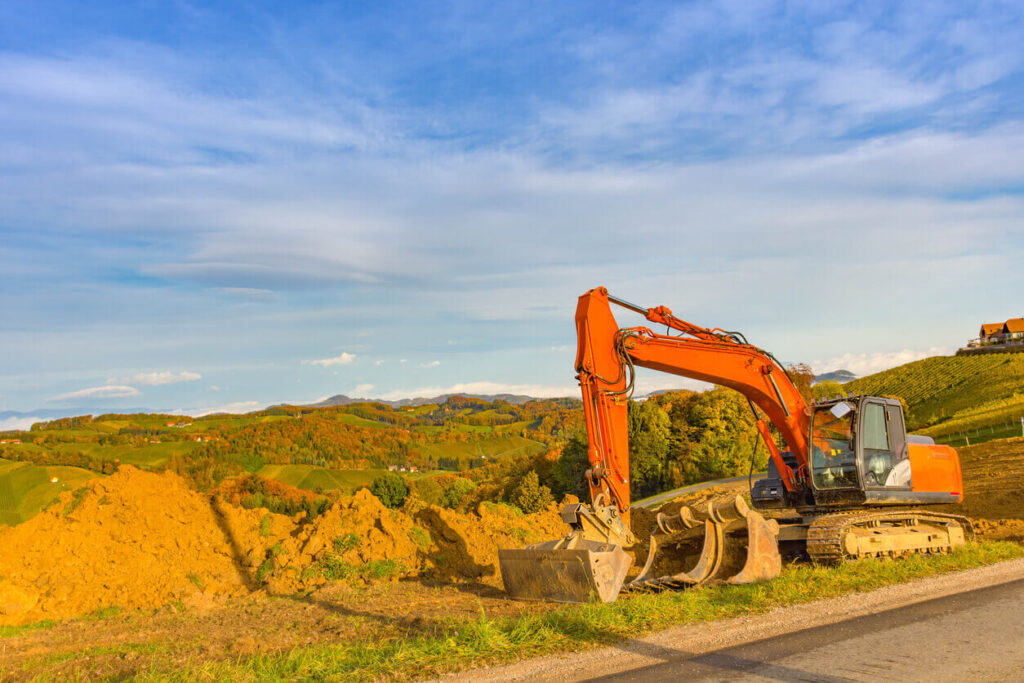 Hitachi excavator digging in fall season