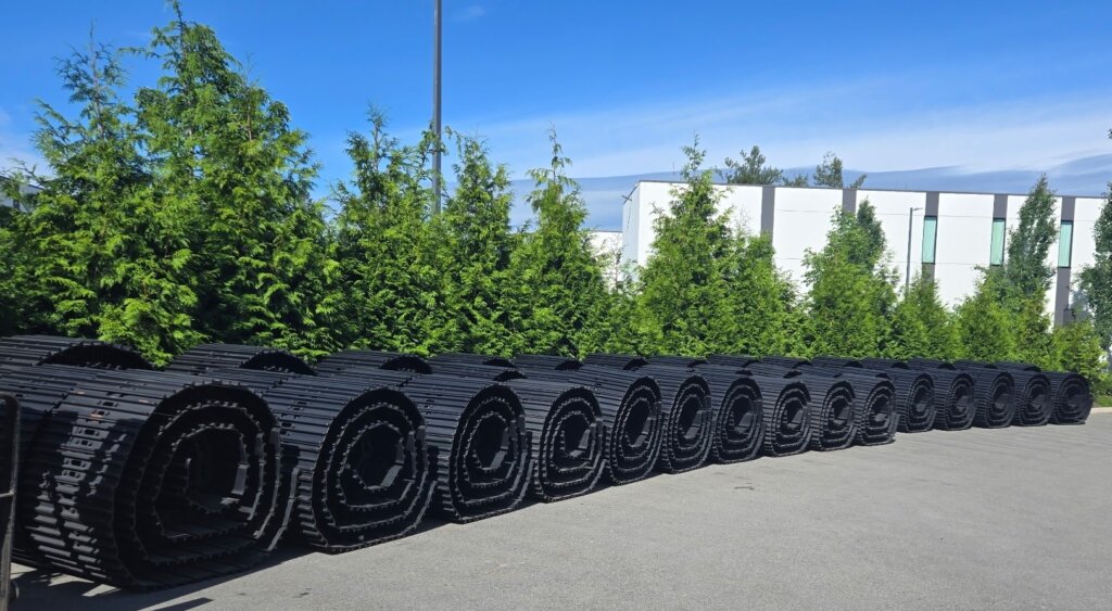 a group of excavator oem tracks outside Langley Excavator Parts